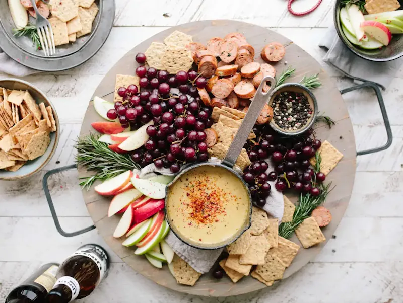 Image of Restaurante Mirador las Cortes flat lay photography of sliced apples, sausages, chips and brown sauce | Photo by Brooke Lark, on https://unsplash.com/@brookelark?utm_source=centralapp&utm_medium=referral