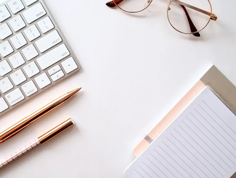 pen near black lined paper and eyeglasses | Photo by Jess Bailey, on https://unsplash.com/@jessbaileydesigns?utm_source=centralapp&utm_medium=referral