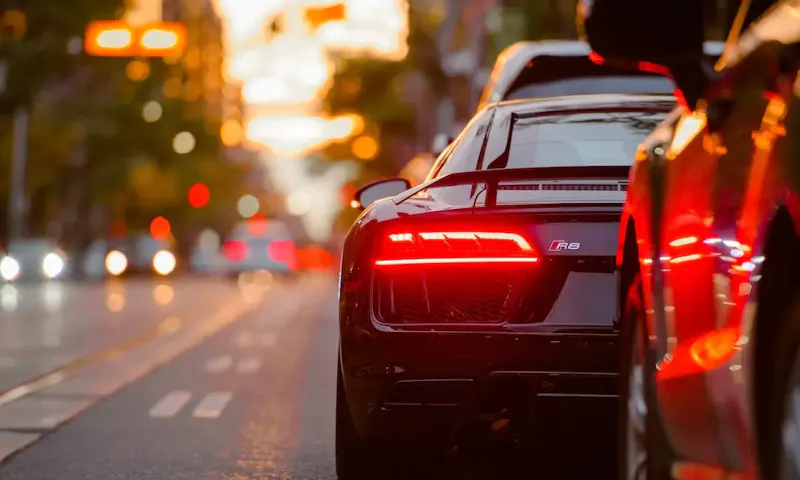 black Audi R8 parked beside road | Photo by Evgeny Tchebotarev, on https://unsplash.com/@ev25?utm_source=centralapp&utm_medium=referral