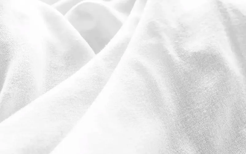 a black and white photo of a white sheet | Photo by Sandra Filipe, on https://unsplash.com/@sandra_filipe?utm_source=CentralApp&utm_medium=referral