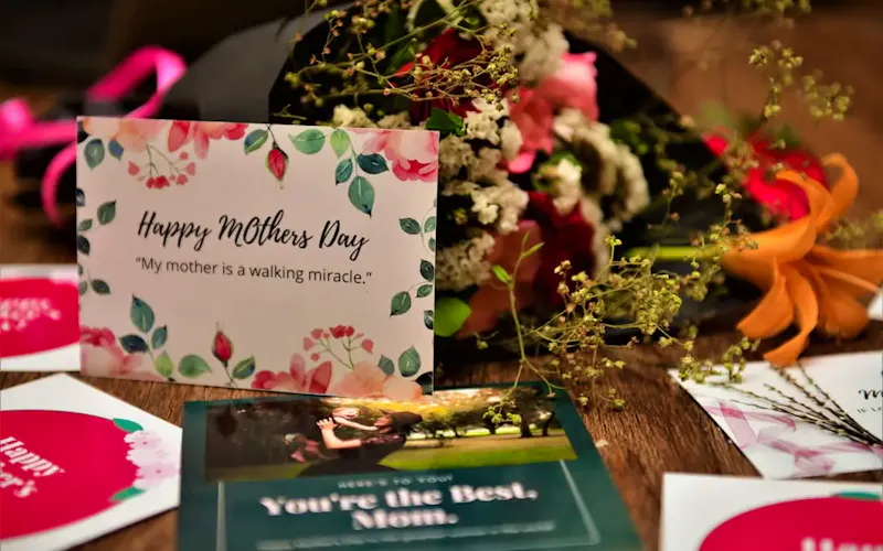 Image of Rishi's in Slate And Grain Brasserie & Bar happy birthday greeting card on brown wooden table | Photo by Ijaz Rafi, on https://unsplash.com/@ijazrafi?utm_source=CentralApp&utm_medium=referral