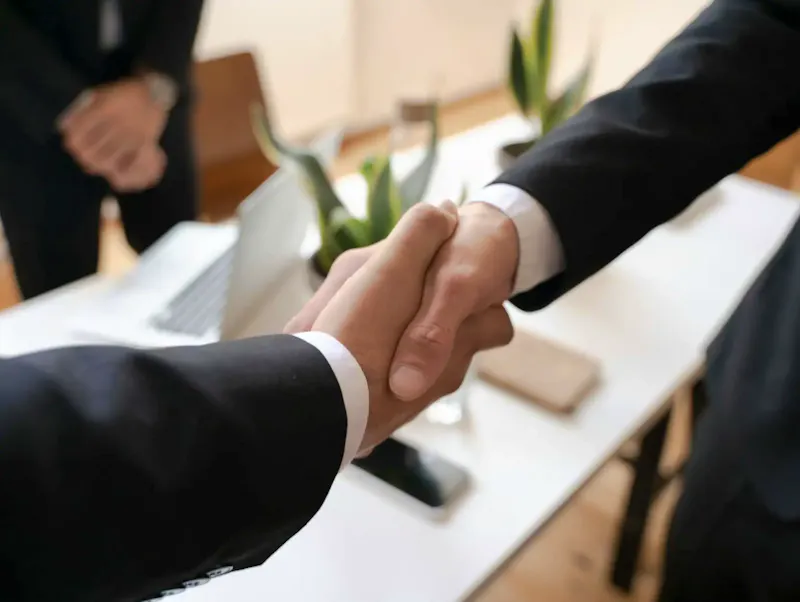 Close-up of a handshake between two professionals in a business setting, symbolizing agreement. | Photo by Pavel Danilyuk, on https://www.pexels.com/@pavel-danilyuk?utm_source=centralapp&utm_medium=referral