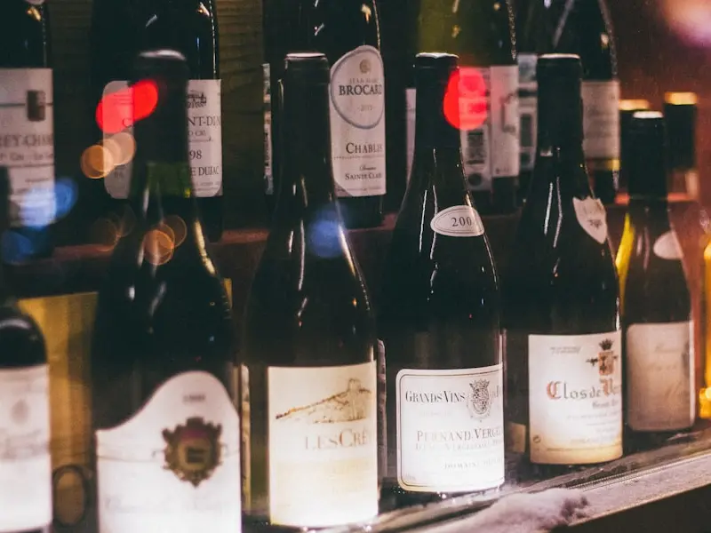 liquor bottles on shelf | Photo by N., on https://unsplash.com/@ellladee?utm_source=centralapp&utm_medium=referral
