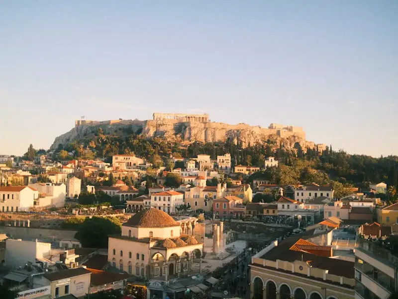 A view of a city with a hill in the background | Photo by Matthew Ye, on https://unsplash.com/@matthewye?utm_source=CentralApp&utm_medium=referral