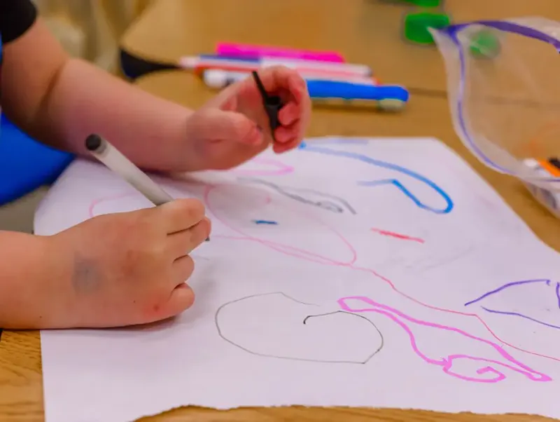 Image of Youpi Bugs a child is drawing on a piece of paper | Photo by Erika Fletcher, on https://unsplash.com/@joyshotsphotography?utm_source=centralapp&utm_medium=referral